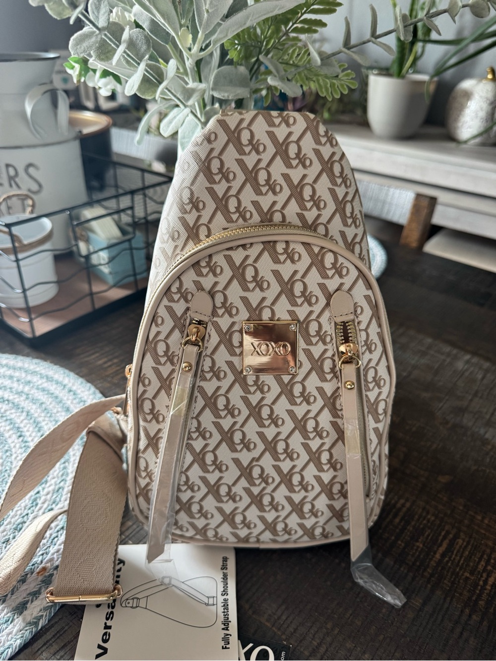 XOXO Taupe Monogram Sling Backpack with Gold Hardware